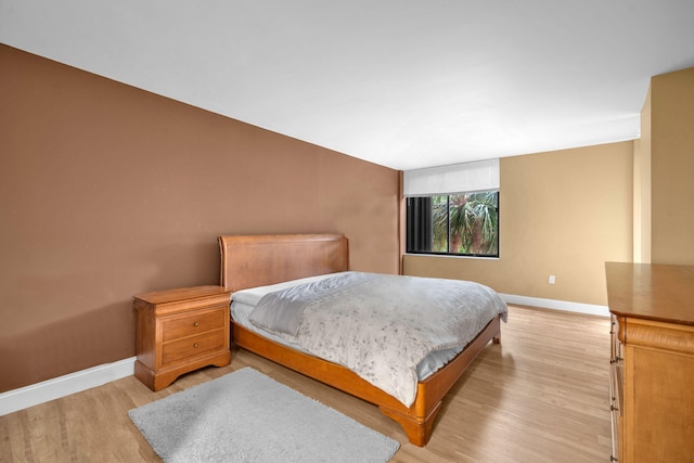 2480 Presidential Way Unit 303, West Palm Beach, FL 33401 - bedroom with light wood finished floors and baseboards
