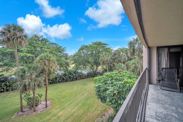 2480 Presidential Way Unit 303, West Palm Beach, FL 33401 - view of grassy yard with a balcony