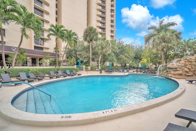 2480 Presidential Way Unit 303, West Palm Beach, FL 33401 - community pool featuring a patio