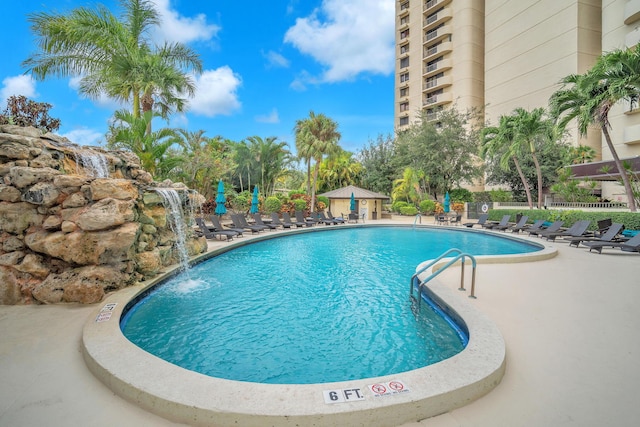 2480 Presidential Way Unit 303, West Palm Beach, FL 33401 - community pool featuring a patio area