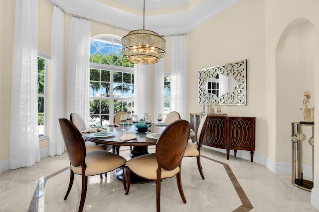 8380 Woodsmuir Dr, West Palm Beach, FL 33412 - dining room with inlaid floor details, baseboards, crown molding, a chandelier, and a towering ceiling