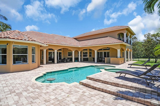 8380 Woodsmuir Dr, West Palm Beach, FL 33412 - view of swimming pool featuring a patio and a pool with connected hot tub