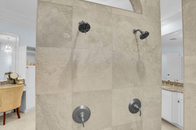 8380 Woodsmuir Dr, West Palm Beach, FL 33412 - bathroom with ornamental molding, tiled shower, and vanity