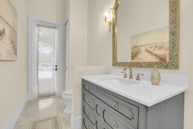 8380 Woodsmuir Dr, West Palm Beach, FL 33412 - bathroom featuring toilet, vanity, and baseboards