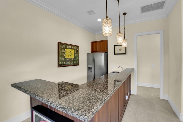 8380 Woodsmuir Dr, West Palm Beach, FL 33412 - kitchen featuring stainless steel fridge with ice dispenser, a peninsula, brown cabinets, a sink, and light colored carpet