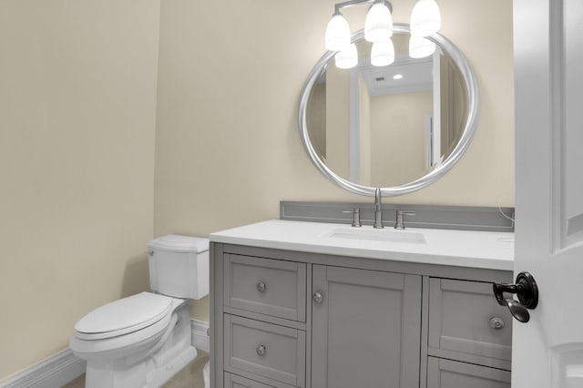8380 Woodsmuir Dr, West Palm Beach, FL 33412 - bathroom with toilet, vanity, and baseboards