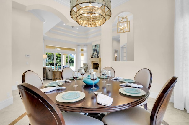 8380 Woodsmuir Dr, West Palm Beach, FL 33412 - dining space featuring ornamental molding, a chandelier, a tray ceiling, and baseboards
