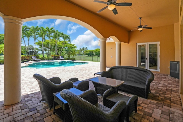 8380 Woodsmuir Dr, West Palm Beach, FL 33412 - view of patio / terrace featuring french doors, a ceiling fan, and a pool with connected hot tub