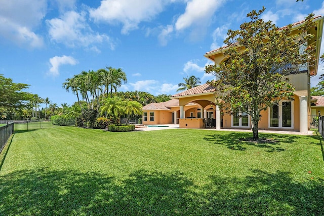8380 Woodsmuir Dr, West Palm Beach, FL 33412 - view of yard featuring french doors and a patio