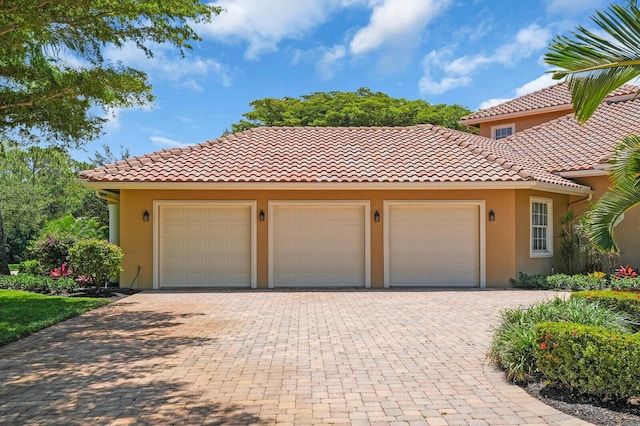 8380 Woodsmuir Dr, West Palm Beach, FL 33412 - view of front facade with stucco siding and a tiled roof