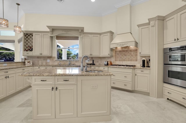 8380 Woodsmuir Dr, West Palm Beach, FL 33412 - kitchen featuring a sink, crown molding, stainless steel appliances, a kitchen island with sink, and light stone counters