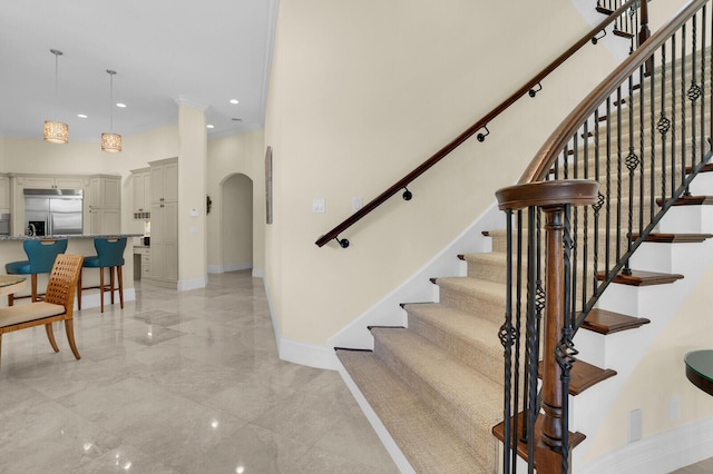 8380 Woodsmuir Dr, West Palm Beach, FL 33412 - staircase featuring arched walkways, baseboards, recessed lighting, and marble tiled flooring