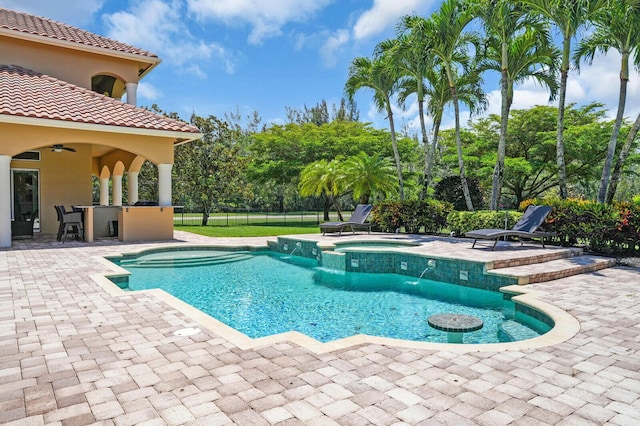 8380 Woodsmuir Dr, West Palm Beach, FL 33412 - view of swimming pool featuring a patio area, a ceiling fan, and a pool with connected hot tub