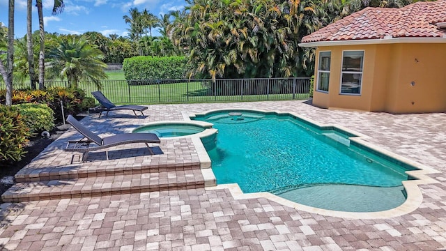 8380 Woodsmuir Dr, West Palm Beach, FL 33412 - view of swimming pool with a patio area, a fenced backyard, and a pool with connected hot tub