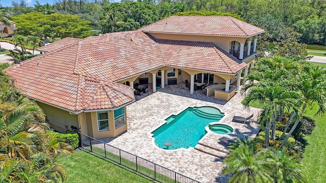 8380 Woodsmuir Dr, West Palm Beach, FL 33412 - view of pool featuring a fenced backyard, a patio area, and a pool with connected hot tub