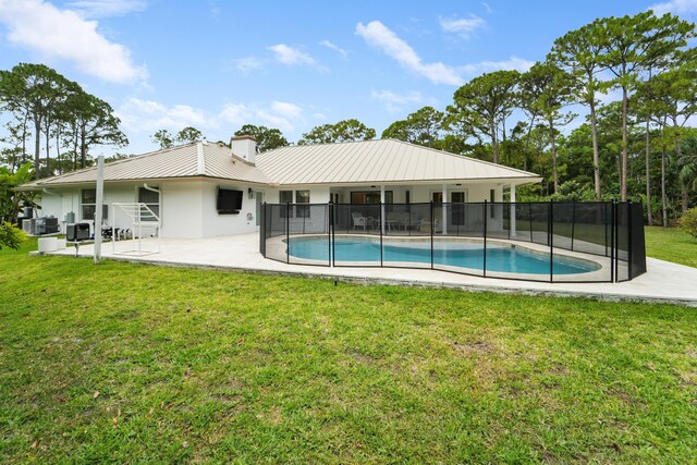 15864 78th Dr N, Palm Beach Gardens, FL 33418 - back of house with a patio, stucco siding, metal roof, a chimney, and cooling unit
