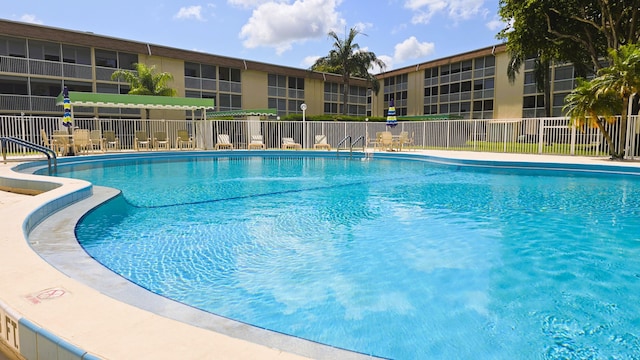 community pool with fence