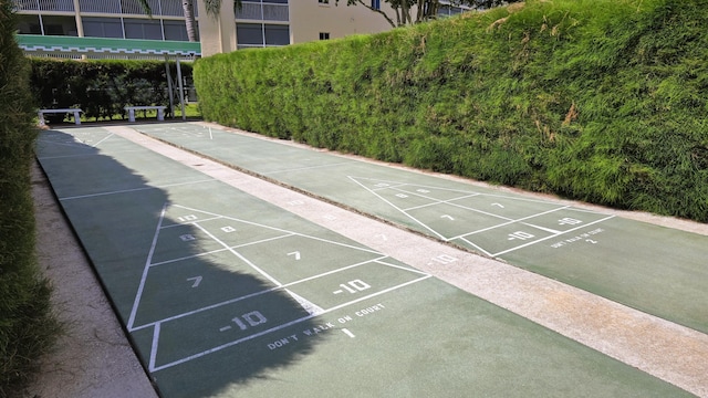 view of property's community featuring shuffleboard