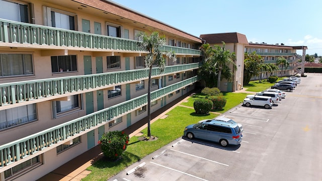 view of property with uncovered parking