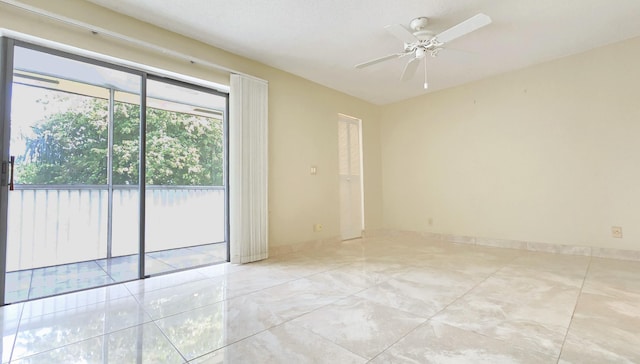 spare room with a ceiling fan