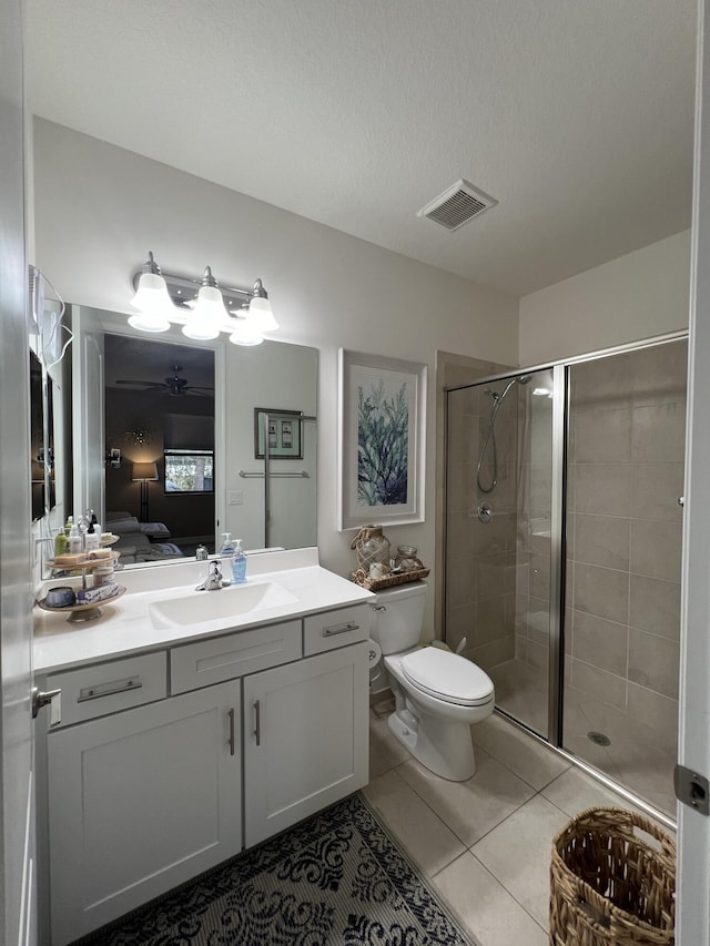 13044 Anthorne Ln, Boynton Beach, FL 33436 - ensuite bathroom featuring toilet, a stall shower, vanity, and tile patterned floors