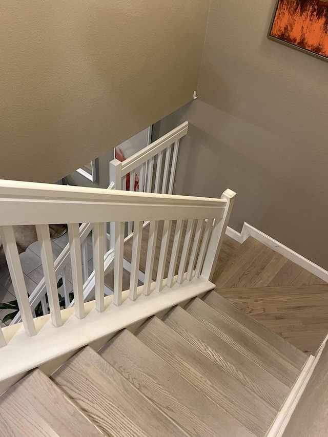 13044 Anthorne Ln, Boynton Beach, FL 33436 - stairs with vaulted ceiling and baseboards