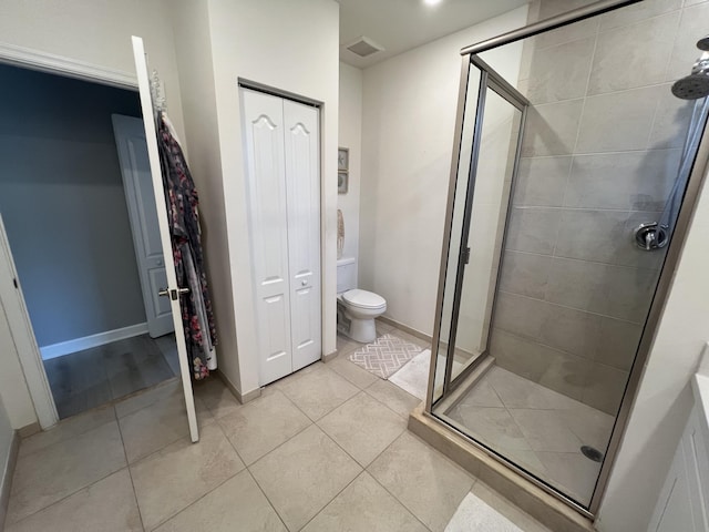 13044 Anthorne Ln, Boynton Beach, FL 33436 - bathroom with a closet, a shower stall, tile patterned floors, and toilet