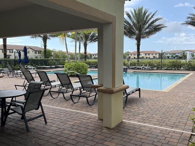 13044 Anthorne Ln, Boynton Beach, FL 33436 - community pool with a patio and a residential view