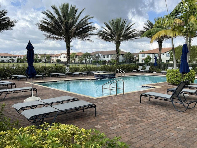 13044 Anthorne Ln, Boynton Beach, FL 33436 - community pool with a patio area, a residential view, and a jacuzzi