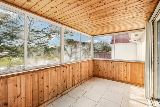 12012 Greenway Cir S Unit 206, Royal Palm Beach, FL 33411 - unfurnished sunroom featuring wood walls, healthy amount of natural light, wood ceiling, and tile patterned floors