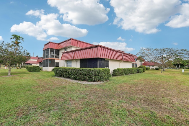 12012 Greenway Cir S Unit 206, Royal Palm Beach, FL 33411 - view of home's exterior featuring a yard and stucco siding