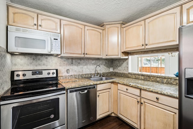 12012 Greenway Cir S Unit 206, Royal Palm Beach, FL 33411 - kitchen featuring stainless steel appliances, light brown cabinets, a sink, dark wood-type flooring, and a textured ceiling