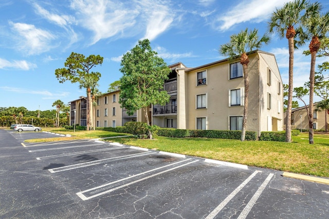 view of property with uncovered parking