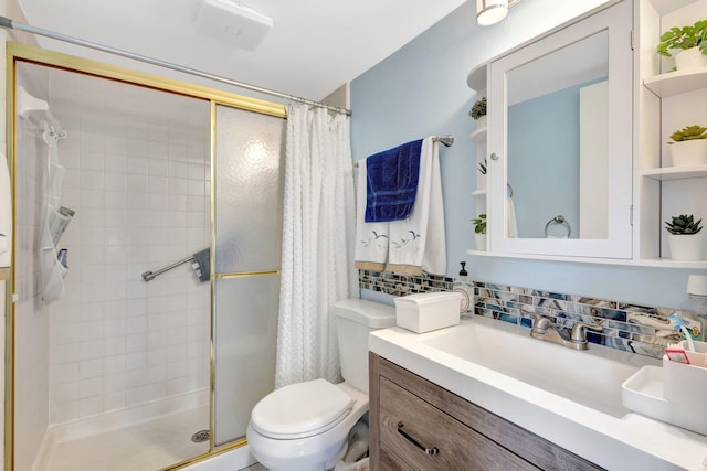 bathroom featuring a stall shower, toilet, decorative backsplash, and vanity