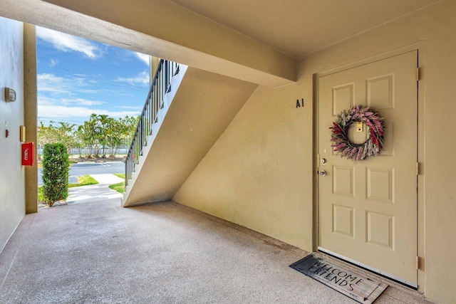 property entrance featuring stucco siding