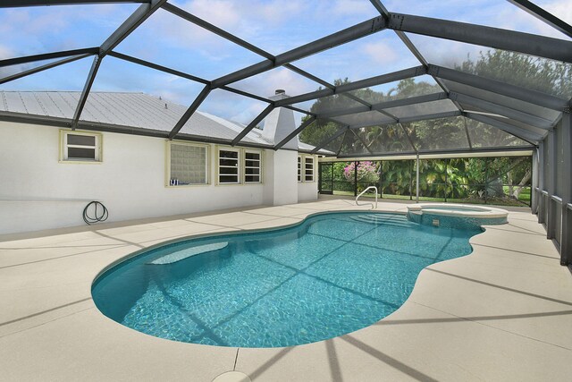 895 SE Waterside Way, Stuart, FL 34997 - view of pool featuring a patio area and a pool with connected hot tub