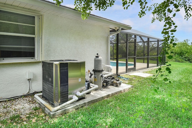 895 SE Waterside Way, Stuart, FL 34997 - exterior view of stucco siding, cooling unit, and a swimming pool