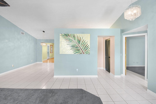 895 SE Waterside Way, Stuart, FL 34997 - empty room with light tile patterned floors, a chandelier, and baseboards