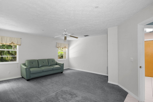 895 SE Waterside Way, Stuart, FL 34997 - carpeted living area with a ceiling fan, a textured ceiling, and baseboards