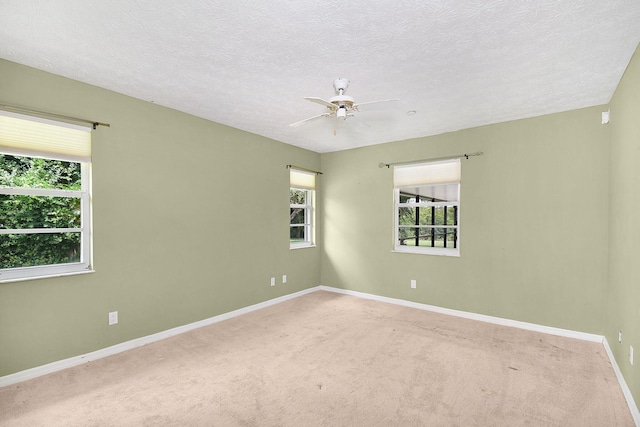 895 SE Waterside Way, Stuart, FL 34997 - unfurnished room featuring a ceiling fan, carpet flooring, baseboards, and a textured ceiling