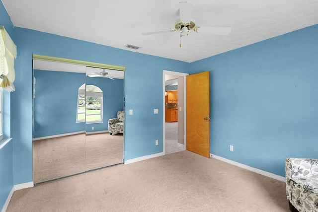 895 SE Waterside Way, Stuart, FL 34997 - unfurnished bedroom featuring carpet floors, a closet, baseboards, and ceiling fan