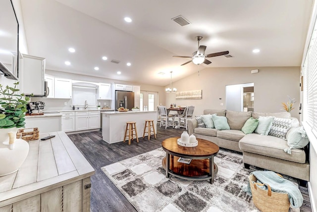 living room featuring lofted ceiling, dark wood-style flooring, a ceiling fan, and recessed lighting