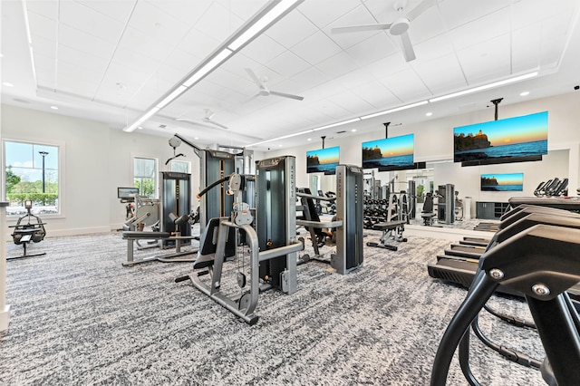 workout area with carpet, ceiling fan, a raised ceiling, baseboards, and recessed lighting