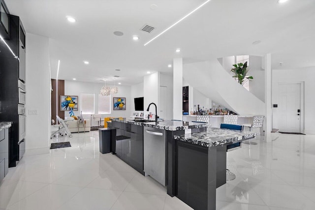 682 Cresta Cir, West Palm Beach, FL 33413 - kitchen featuring modern cabinets, appliances with stainless steel finishes, a large island with sink, open floor plan, and a sink