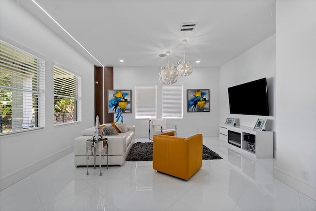 682 Cresta Cir, West Palm Beach, FL 33413 - living room featuring a chandelier, baseboards, light tile patterned floors, and recessed lighting