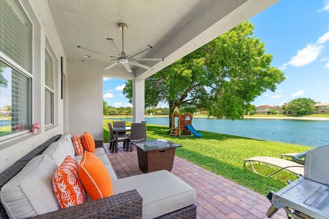 682 Cresta Cir, West Palm Beach, FL 33413 - view of patio featuring ceiling fan, a water view, a playground, and an outdoor hangout area