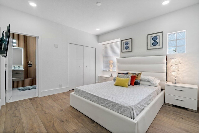 682 Cresta Cir, West Palm Beach, FL 33413 - bedroom with wood finished floors, a closet, and recessed lighting