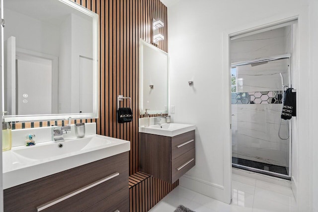 682 Cresta Cir, West Palm Beach, FL 33413 - full bath featuring a marble finish shower, baseboards, two vanities, and tile patterned floors