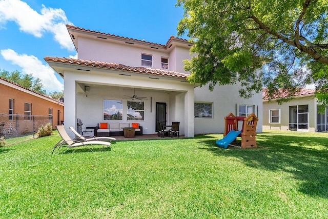 682 Cresta Cir, West Palm Beach, FL 33413 - rear view of property with stucco siding, a ceiling fan, and outdoor lounge area