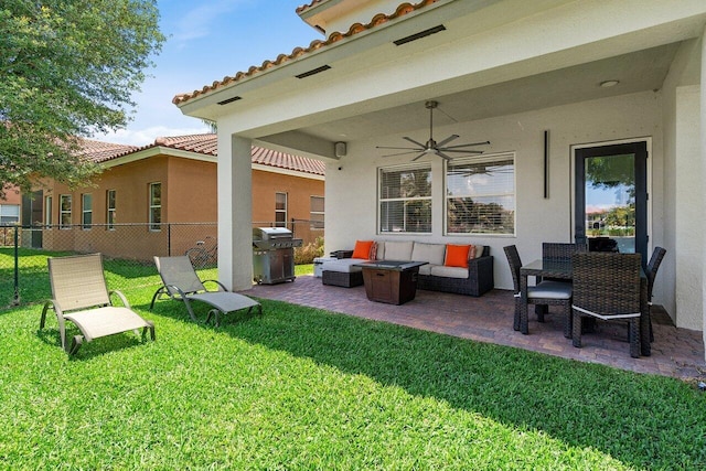 682 Cresta Cir, West Palm Beach, FL 33413 - view of patio with grilling area, an outdoor hangout area, and a ceiling fan